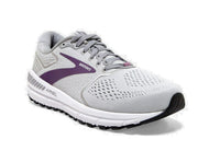 Light greyish white brooks athletic shoe with purple swish
